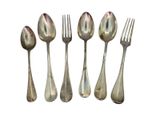 four silver spoons and a fork on a white background