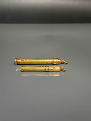 a close up of a pen laying on top of a table