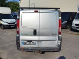 a silver van that is parked in a parking lot