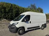a picture of a white van parked in a lot
