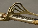 a close up of a sword with a lion head on it