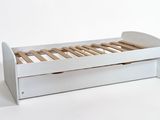 a white bed with wooden slats and a drawer underneath it