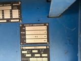 a close up of a blue machine with a lot of information on it