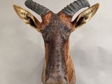 a statue of a goat with horns on it ' s head