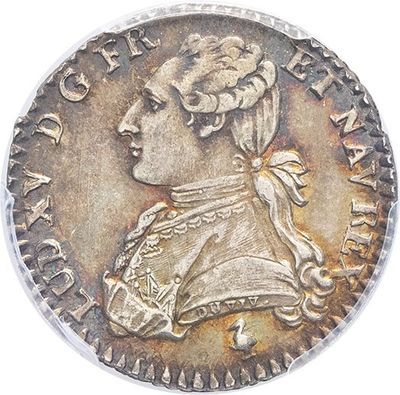a close up of a silver coin with a woman ' s head on it
