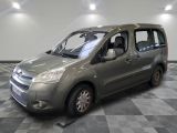 a silver van that is parked in a room