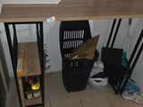 an image of a room with a desk and a chair