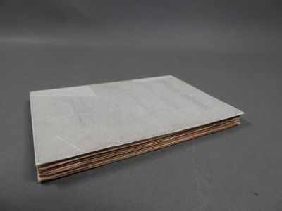a stack of brown paper sitting on top of a table