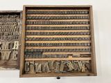 an old typewriter ' s box filled with different types of letters
