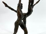 bronze sculpture of two dancers on a white background