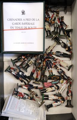 a box with a bunch of toy soldiers in it