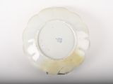 a white plate with a flower design on it
