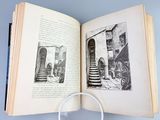 an open book with a magnifying glass on it