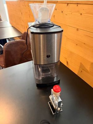 a blender sitting on a black table in a room