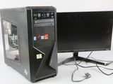 un ordinateur de bureau équipé d'un écran et d'un clavier, posé sur le bureau