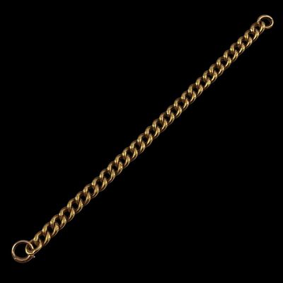 a close up of a gold chain bracelet on a black background