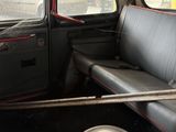 a black car with two speakers in the back of it