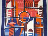 blue, orange, and white square scarf with a picture of a building