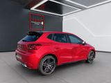 the rear end of a red car parked in a garage