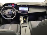 a picture of the interior of a car with a steering wheel and dashboard