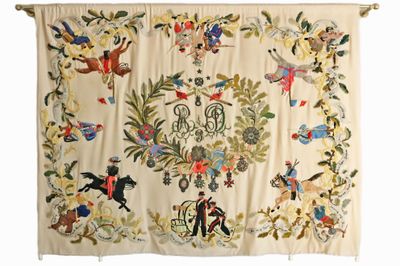 une tapisserie ancienne brodée représentant un cheval et son cavalier