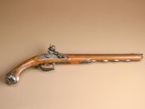 an old gun that is on the wall of a room