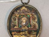 a small locke with a picture on it hanging from a string