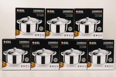 four boxes of casserole with lids are stacked on a table