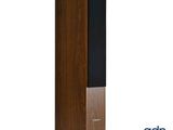a wooden tower speaker with a black base and a white background