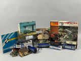 a lot of toy trains and books on the table