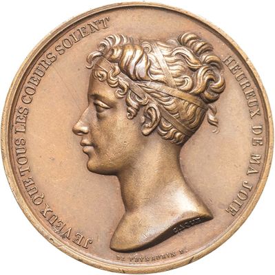 an old bronze medal with a woman ' s head on it ' s side