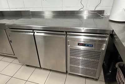 a stainless steel counter top in a commercial kitchen