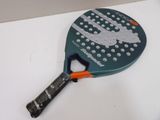 a tennis racket with a bottle opener on it