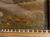 a picture of a painting on a shelf in a room