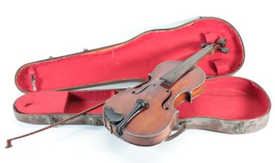a violin that is sitting in a case on the ground