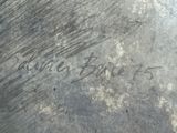 a close up of a piece of metal with writing on it