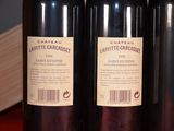 three bottles of wine that are sitting on a table
