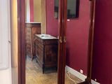 a large mirror in the corner of a room