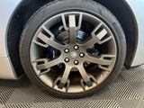 a close up of a tire on a car ' s rim
