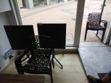 a person sitting in a chair in front of a window