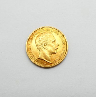 l'image d'une pièce d'or sur laquelle figure le visage d'un homme