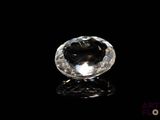 a close up of a diamond on a black surface