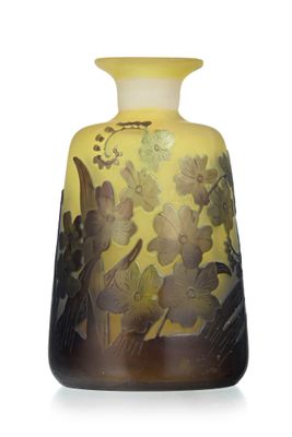 a yellow vase with flowers on it on a white background