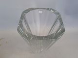 a glass vase that is sitting on a table