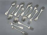 a group of silverware including forks, spoons and knives