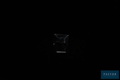 dark room with a small window and a small window in the middle