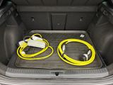 a trunk of a car with two cables in the trunk