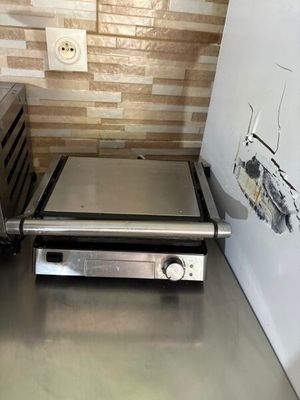 a toaster oven sitting on a counter in a kitchen