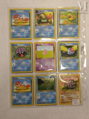 a lot of pokemon cards that are on the table