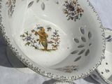 a white bowl with a floral design on it